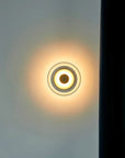 Suspended wall lamp with glass bowl