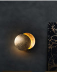 Wall lamp with solar eclipse design