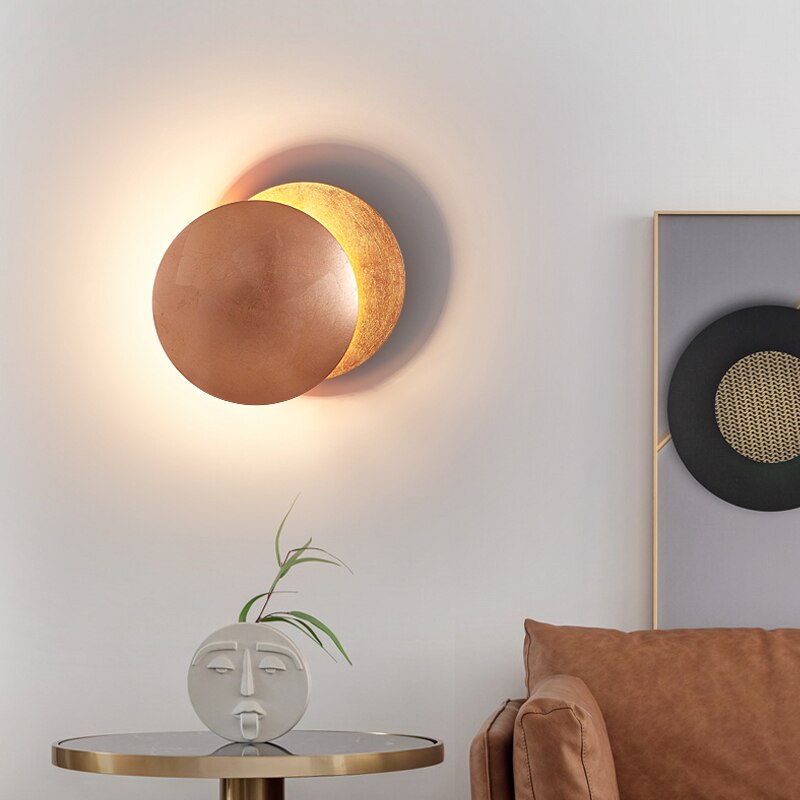 Wall lamp with solar eclipse design