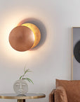 Wall lamp with solar eclipse design