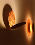 Wall lamp with solar eclipse design