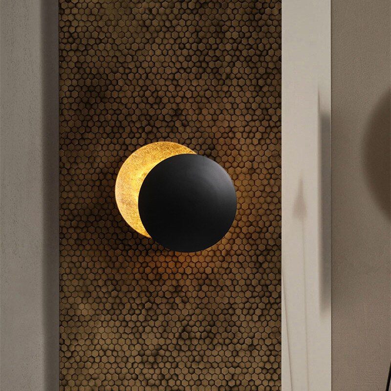 Wall lamp with solar eclipse design