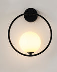 Wall lamp for the bedroom made of metal and glass