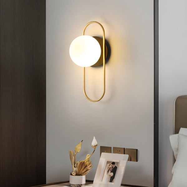 Wall lamp for the bedroom made of metal and glass