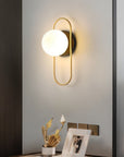 Wall lamp for the bedroom made of metal and glass