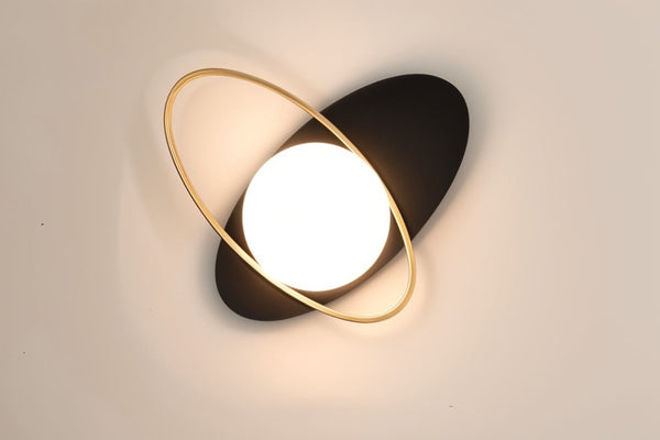 Wall lamp for the bedroom made of metal and glass