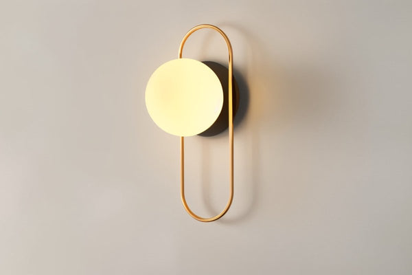 Wall lamp for the bedroom made of metal and glass