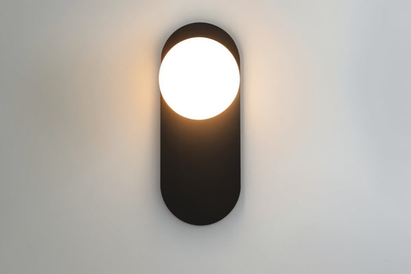 Wall lamp for the bedroom made of metal and glass