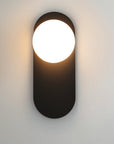 Wall lamp for the bedroom made of metal and glass