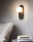 Wall lamp for the bedroom made of metal and glass